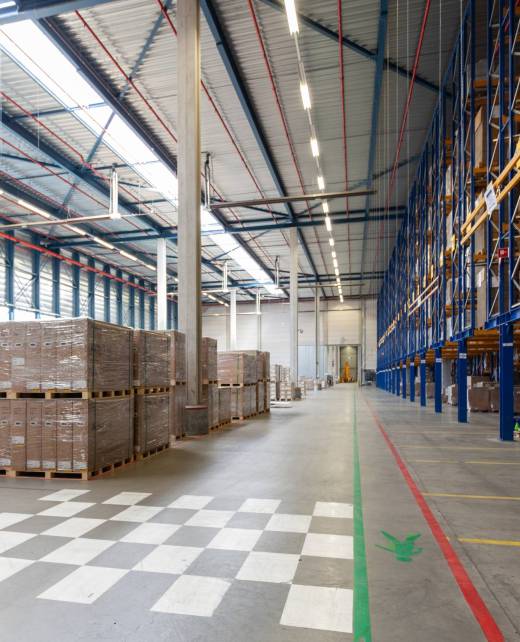 A view of full warehouse with forklift